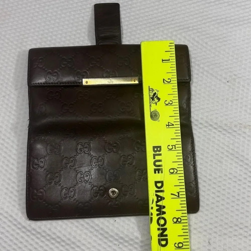 Gucci Dark Brown Embossed Clutch wallet inside is clean. GUC much life left!